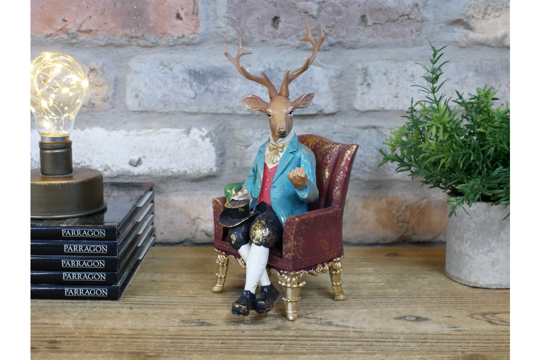 Deer in a Chair Ornament – Whimsical Animal Figurine Décor