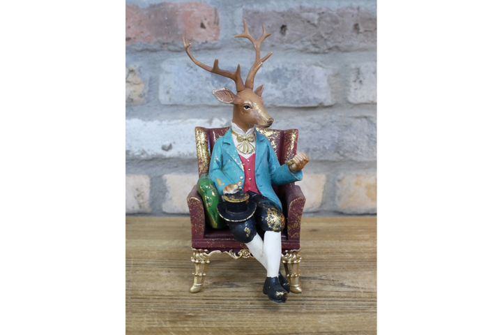 Deer in a Chair Ornament – Whimsical Animal Figurine Décor