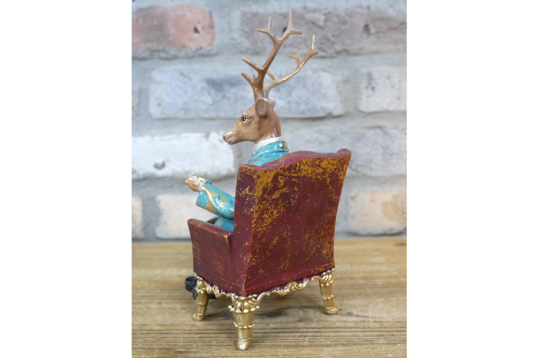 Deer in a Chair Ornament – Whimsical Animal Figurine Décor