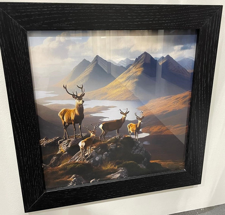 Herd of stags on the top of a cliff with a view and a black frame