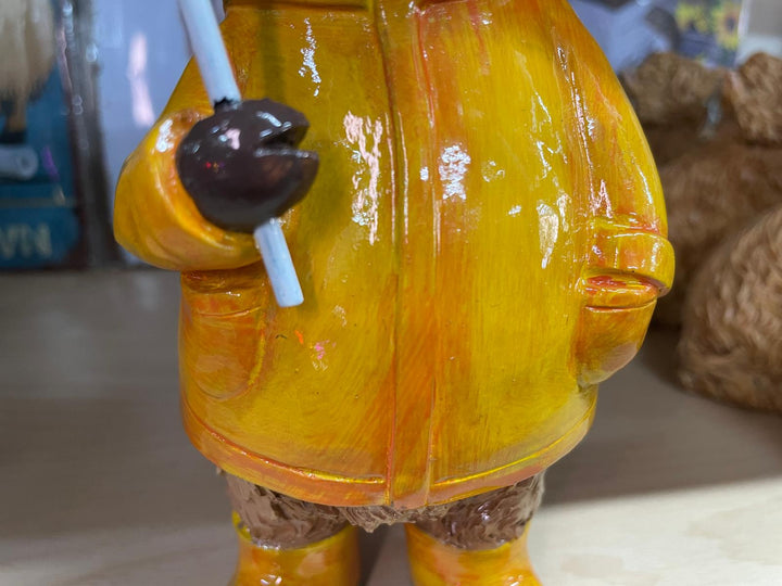 Highland cow in the rain with a blue umbrella yellow rain coat decor ornament