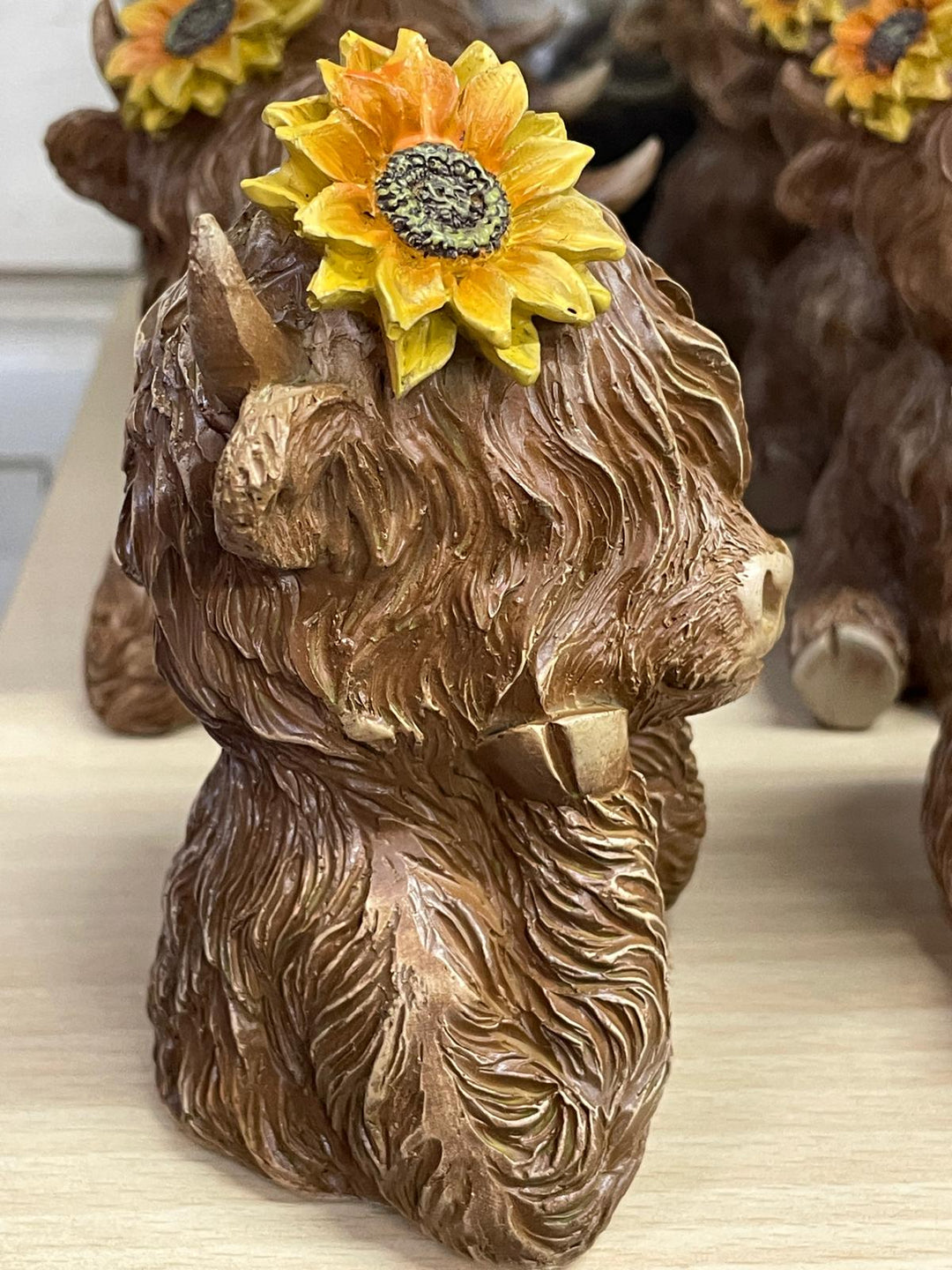 Brown Highland Cow bust with yellow sunflower on head Ornament