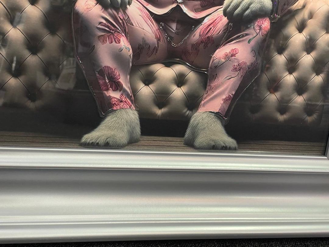 Graphite Framed Polar Bear in Pink Floral Suit Sitting on Couch