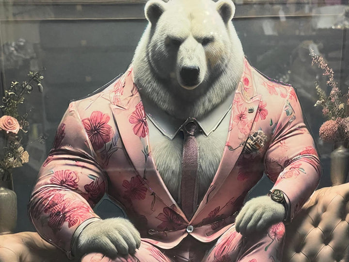 Graphite Framed Polar Bear in Pink Floral Suit Sitting on Couch