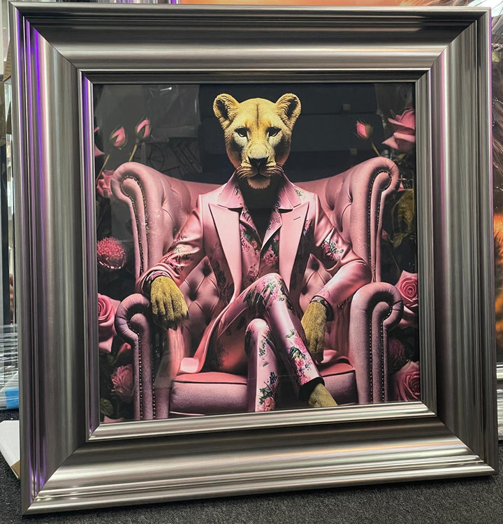 Graphite frame Lioness in a pink floral suit & couch wall art