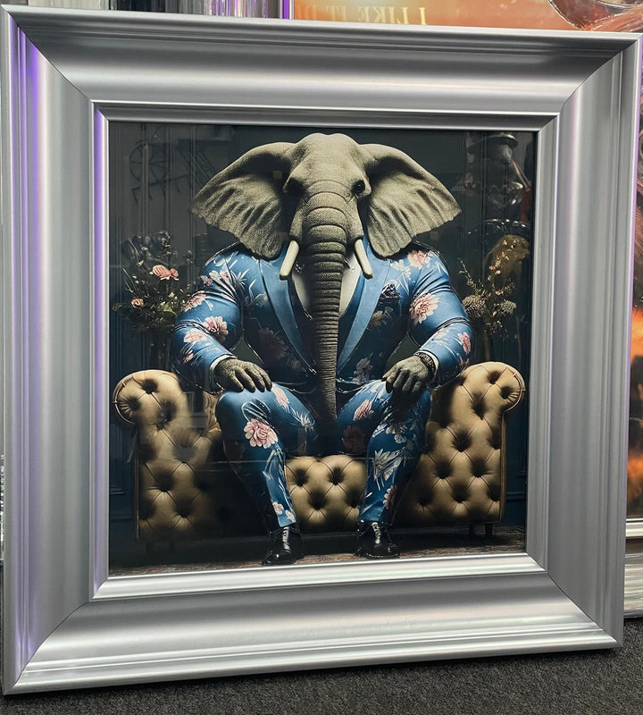 Silver frame picture of Elephant in a blue floral suit couch wall art