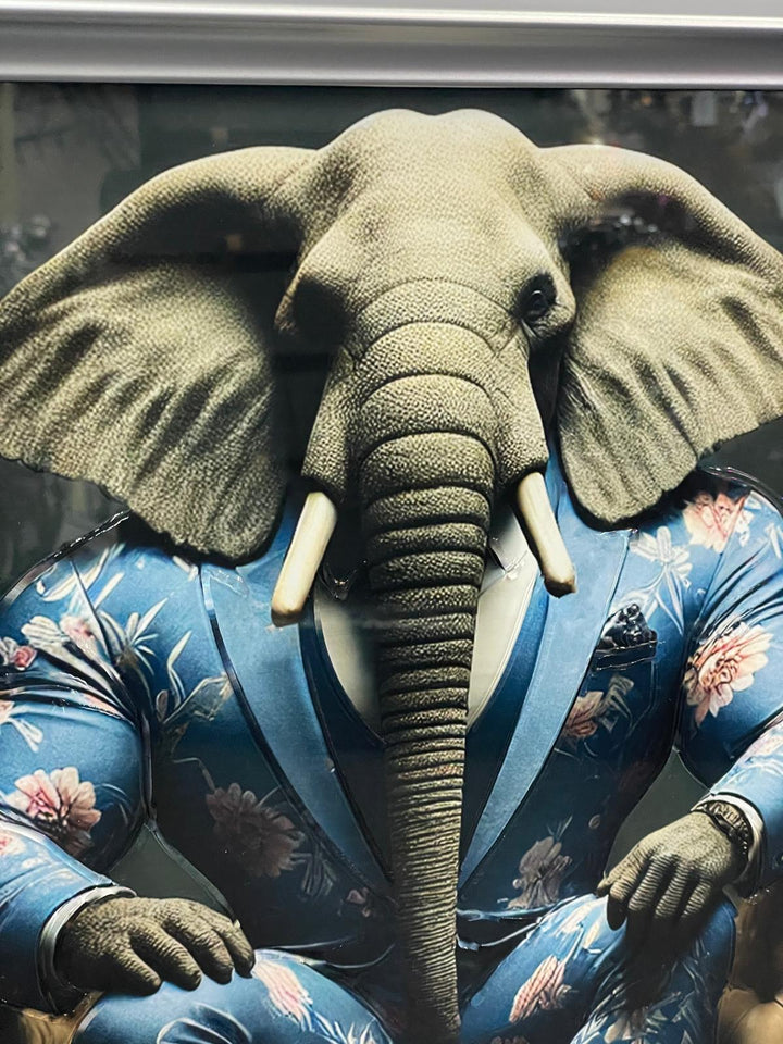 Silver frame picture of Elephant in a blue floral suit couch wall art