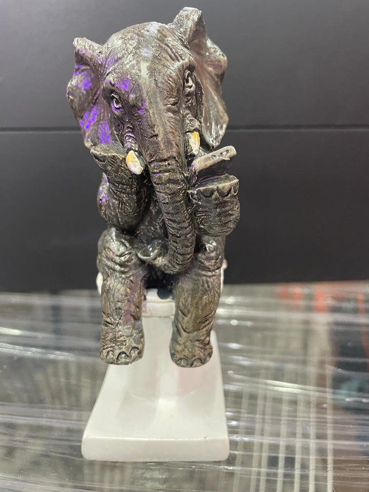 Elephant sitting on the loo with mobile phone quirky ornament