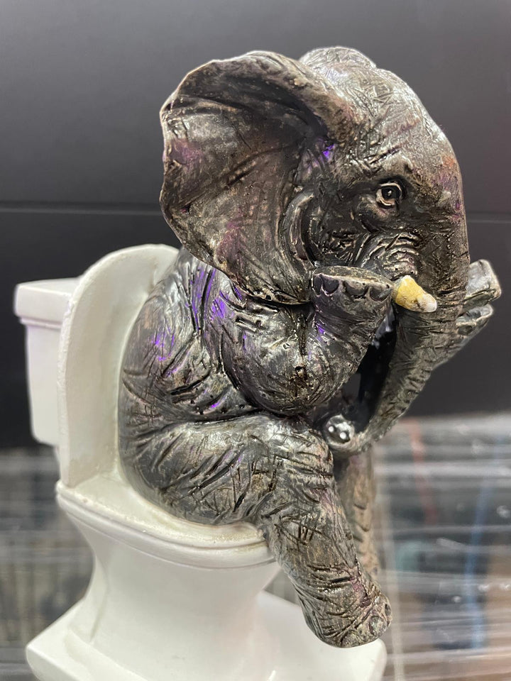 Elephant sitting on the loo with mobile phone quirky ornament