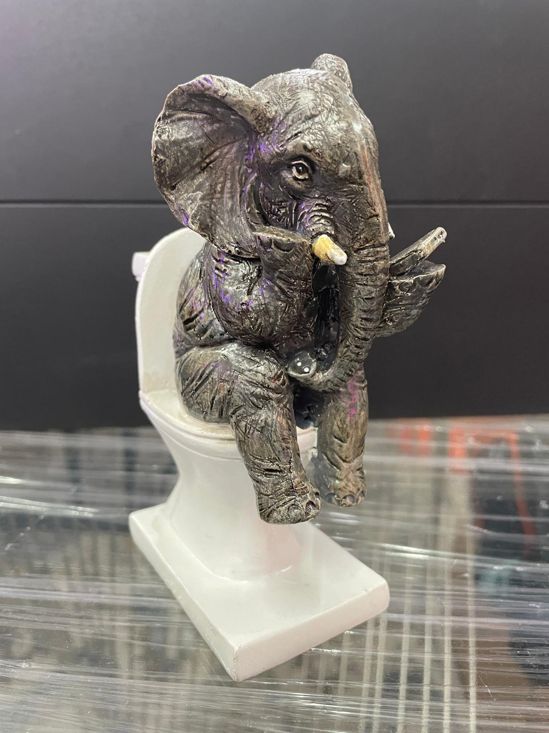 Elephant sitting on the loo with mobile phone quirky ornament