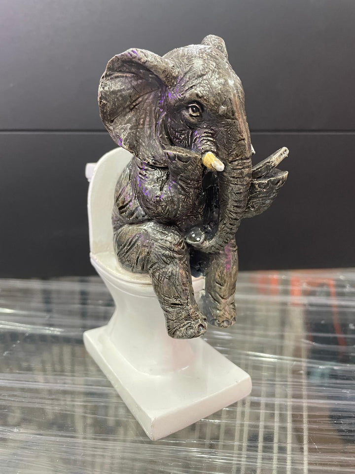 Elephant sitting on the loo with mobile phone quirky ornament