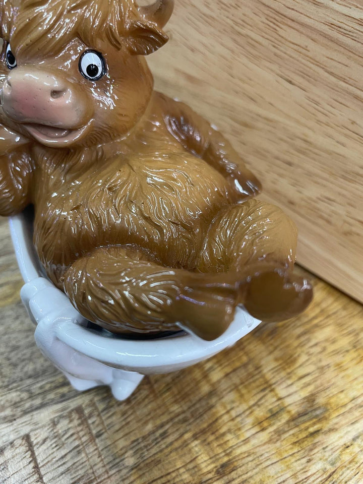 Highland cow in tub & toilet with book quirky ornament