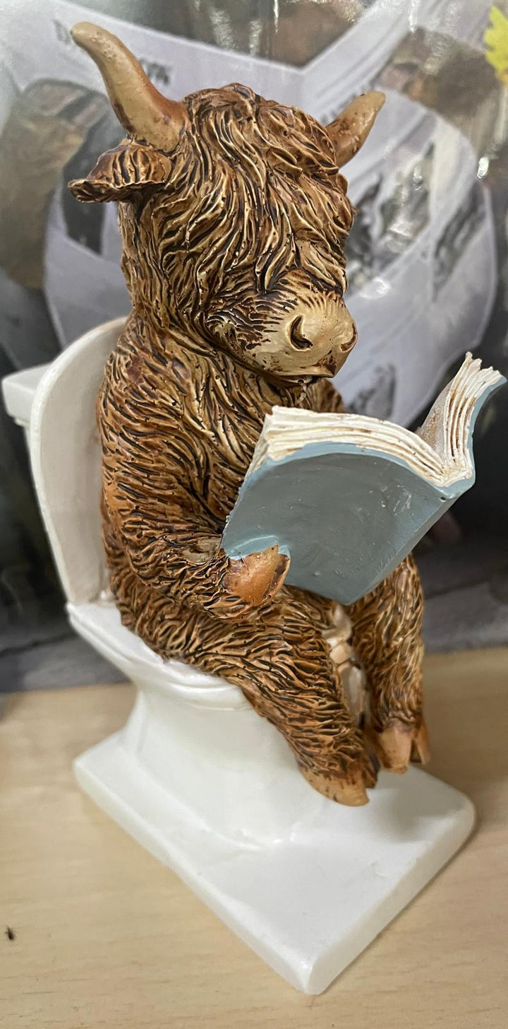 Highland cow in tub & toilet with book quirky ornament
