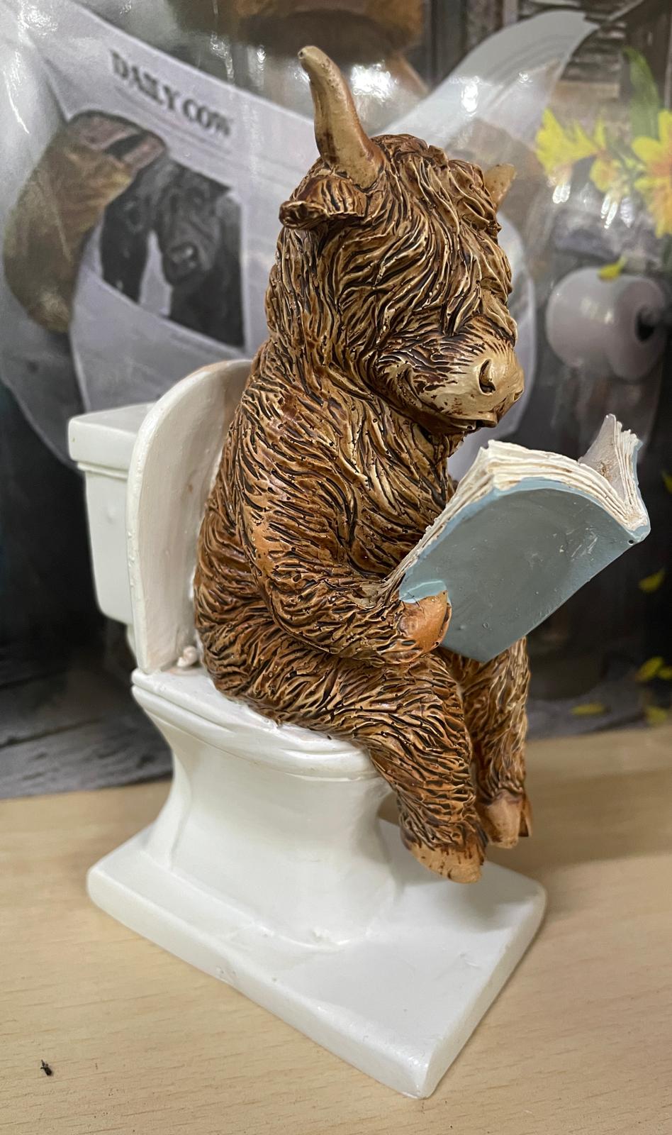 Highland cow in tub & toilet with book quirky ornament