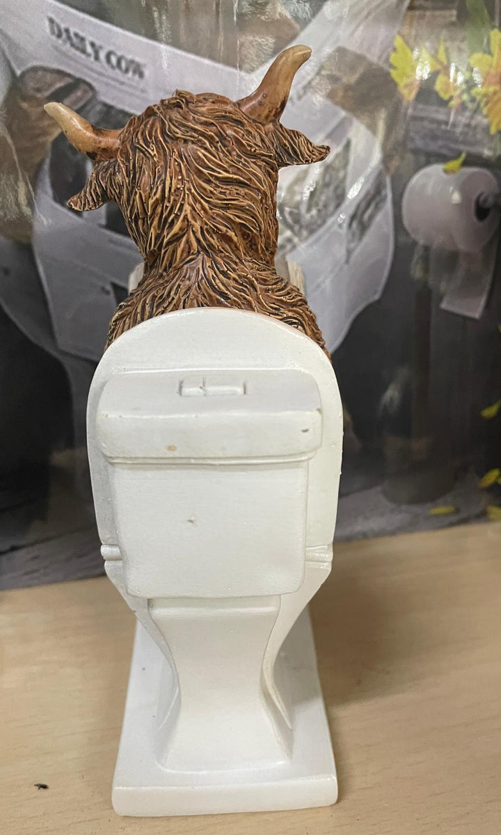 Highland cow in tub & toilet with book quirky ornament