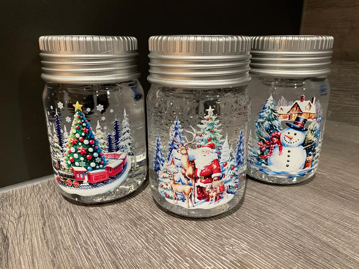 14cm LED Lit Christmas Spinner Jars Festive Decorations Santa, Snowman, train