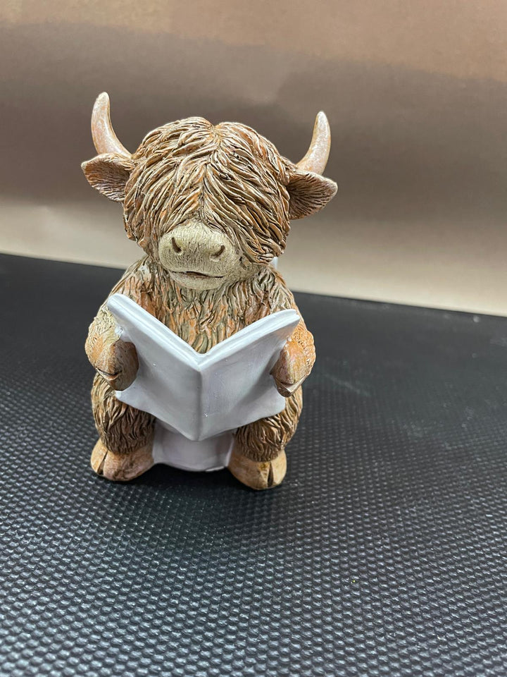 Highland cow in tub & toilet reading book quirky resin ornament