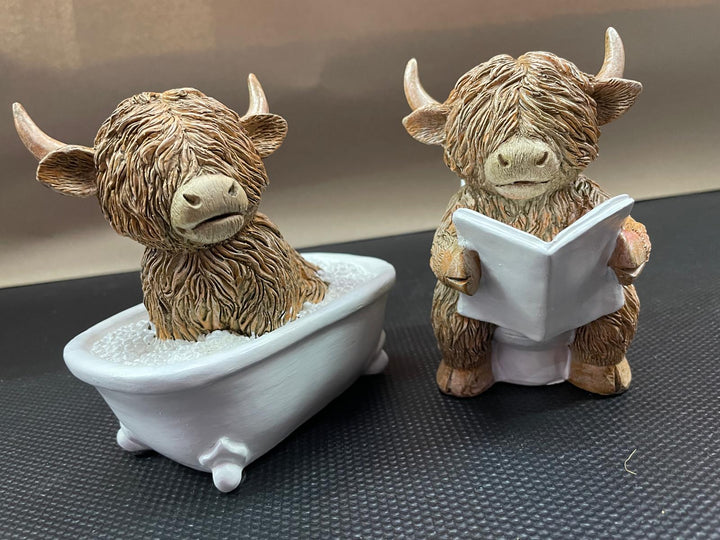 Highland cow in tub & toilet reading book quirky resin ornament