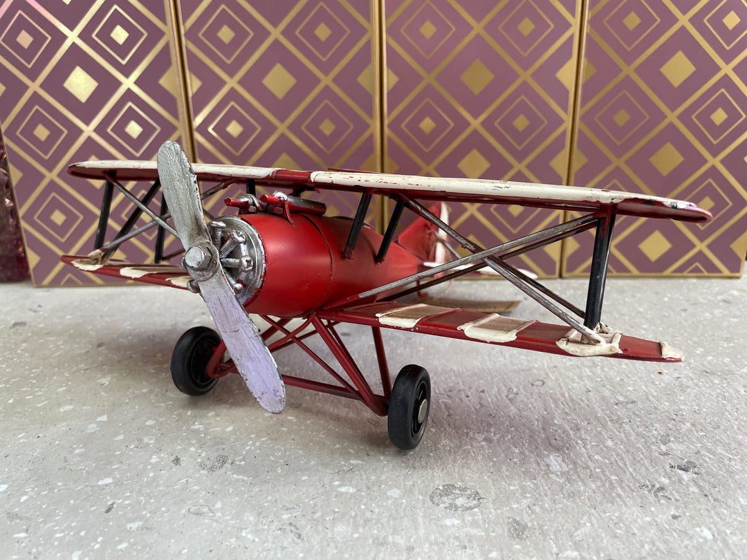 Red yellow bi-plane retro tin vintage transport aeroplane
