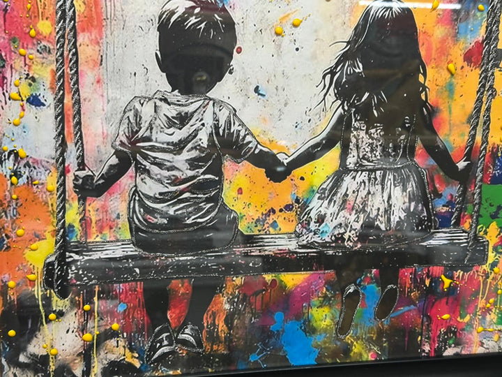 Banksy Brother & Sister Holding Hands on Swing Wall Art | Coloured Liquid Resin Street Art with Black Frame