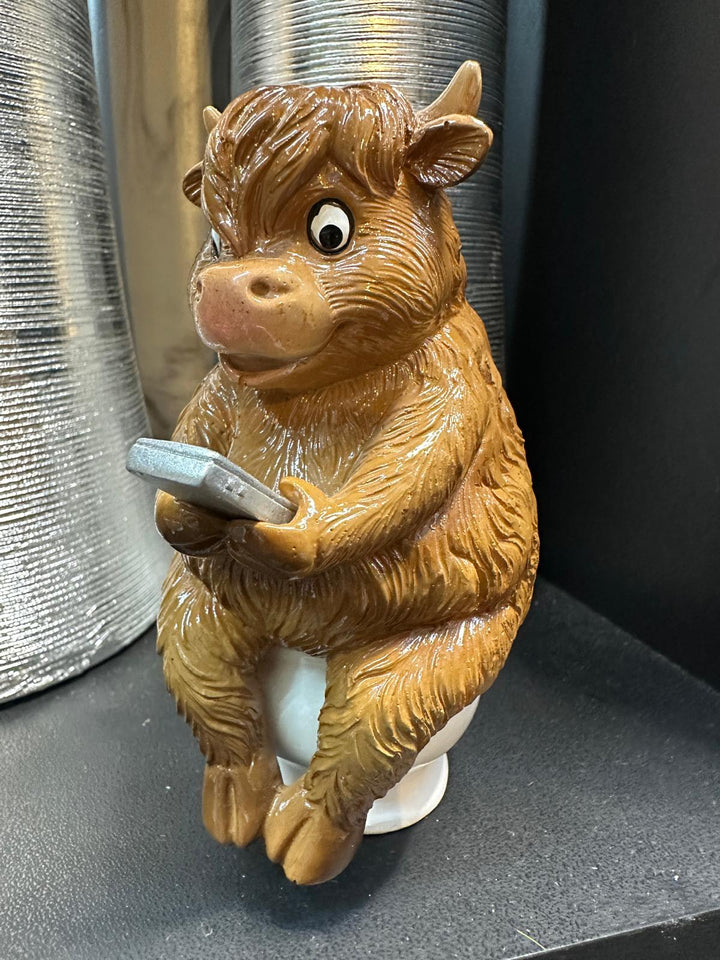 Highland cow in tub & toilet reading book quirky resin ornament